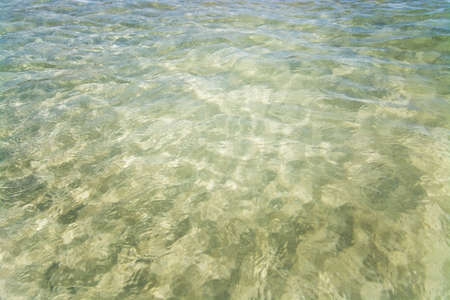 Shallow sand and sea water closeup in Es Trenc Mallorca