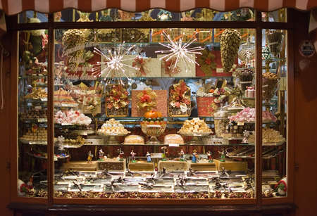 PALMA DE MALLORCA, BALEARIC ISLANDS, SPAIN - DECEMBER 5, 2017: Pajarita Bomboneria store with evening Christmas light decorations on December 5, 2017 in Palma de Mallorca, Balearic islands, Spain.のeditorial素材