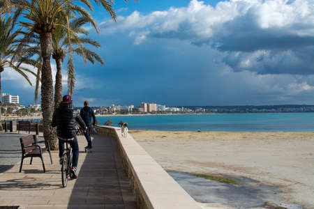 PLAYA DE PALMA, MALLORCA, SPAIN - DECEMBER 16, 2017: Playa de Palma winter beach on a sunny day on December 16, 2017 in Mallorca, Balearic islands, Spainのeditorial素材