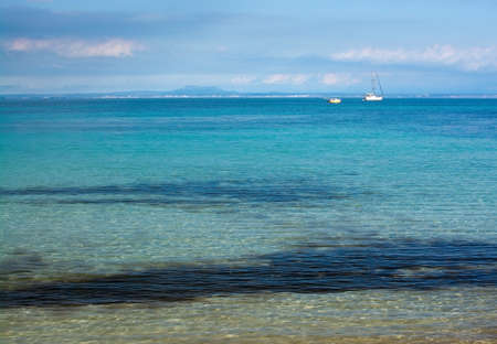 Mallorca seascape with boats on a sunny winter day in February, Mallorca, Spain.の写真素材