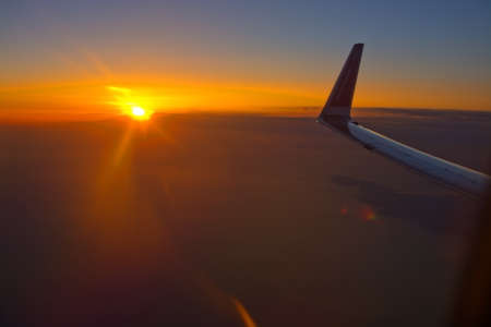 MALLORCA, SPAIN - APRIL 27, 2018: Norwegian flight image at sunrise in the ocean beyond Menorca in an early morning on April 27, 2018 in Mallorca, Spain.のeditorial素材