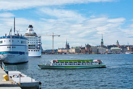 STOCKHOLM, SWEDEN - JULY 11, 2018: Boats for sightseeing and ferry for long distance travel at Stadsgardskajen on July 11, 2018 in Stockholm, Sweden.のeditorial素材