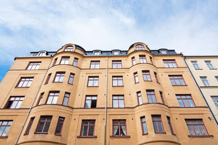 Vasastan typical century old buildings in yellow roughcast in Stockholm, Sweden.