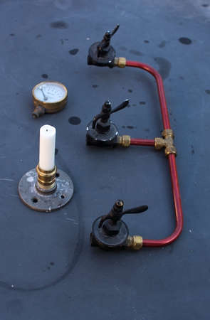 Plumbing and other creative handicraft equipment including a homemade candle holder in a plumbers...