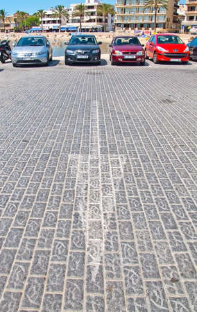 MALLORCA, SPAIN - JULY 21, 2012: Parking spaces filled in front of Can Pastilla hotels and arrow pointing down on a sunny summer day on on July 21, 2012 in Mallorca, Spain.のeditorial素材