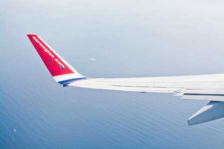PALMA DE MALLORCA, SPAIN - SEPTEMBER 6, 2018: Norwegian wing over the Mediterranean sea with boats...