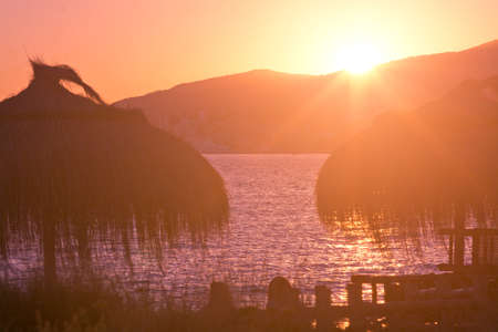 Golden sunshine at sunset on a beautiful beach afternoon in September in Mallorca, Spain.の写真素材