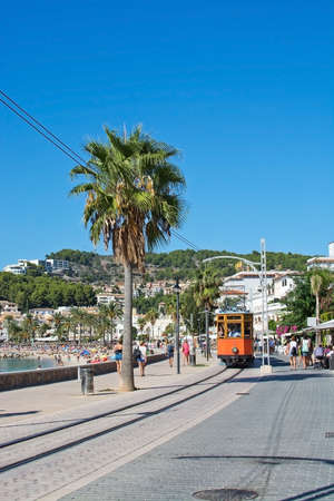 SOLLER, MALLORCA, SPAIN - SEPTEMBER 28, 2018: The old Soller tram on track along the sea promenade...