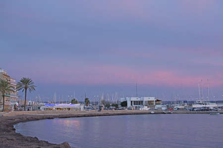MALLORCA, SPAIN - NOVEMBER 24, 2018 Powdery pink winter sunset skies over Can Pastilla marina on November 24, 2018 in Mallorca, Spain.のeditorial素材