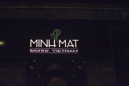 STOCKHOLM, SWEDEN - DECEMBER 29, 2018: Minh Mat Bistro Vietnam restaurant white neon sign in Vasastan at night on December 29, 2019 in Stockholm, Swedenのeditorial素材