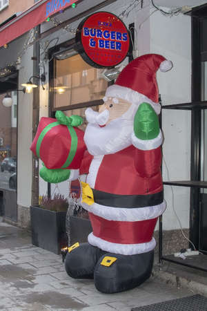 STOCKHOLM, SWEDEN - DECEMBER 29, 2018: Santa Claus welcome at Birka Burgers exterior on Rorstrandsgatan on December 29, 2019 in Stockholm, Swedenのeditorial素材