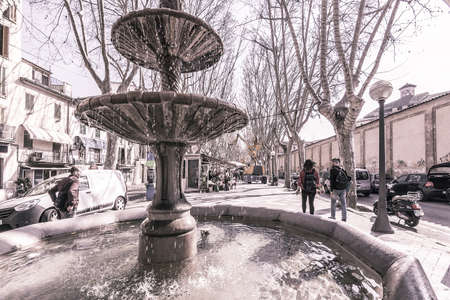 PALMA DE MALLORCA, SPAIN - FEBRUARY 9, 2019: Water fountain and flower vendors on La Rambla on February 9, 2019 in Palma de Mallorca, Spain. Vintage treatment.のeditorial素材