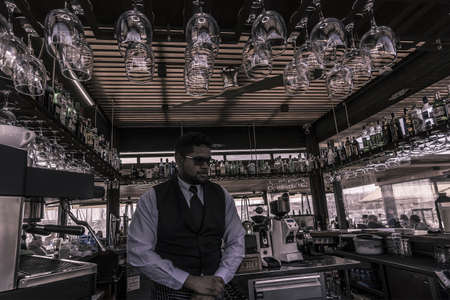 PALMA DE MALLORCA, SPAIN - FEBRUARY 9, 2019: Bartrender inside bar of restaurant Pesquero on February 9, 2019 in Palma de Mallorca, Spain.のeditorial素材