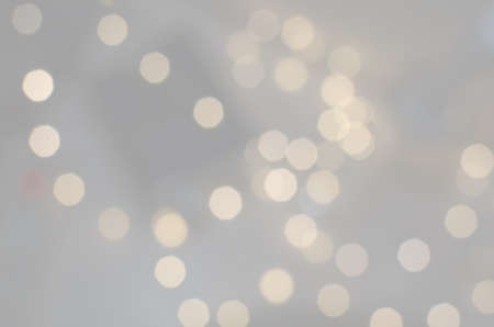 Golden bokeh lights defocussed festive winter background textureの写真素材