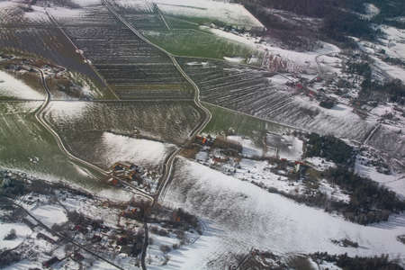 Aerial landscape snowy winter view of farmland on a sunny day in Stockholm, Sweden.の写真素材