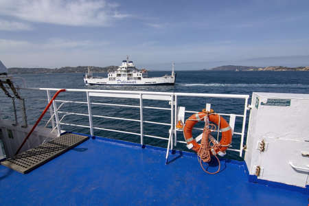 ISOLA MADDALENA, SARDINIA, ITALY - MARCH 7, 2019: Ferry Isola di S. Stefano between Palau and Isola...