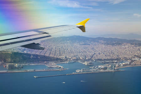 BARCELONA, SPAIN - MARCH 9, 2019: Aerial view of Barcelona with Vueling Airline wing and port, ferries, La Sagrada Familia and various other famous buildings in downtown on March 9, 2019 in Barcelona, Spain.のeditorial素材