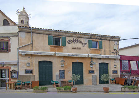 SES SALINES, MALLORCA, SPAIN - APRIL 15, 2019: Bodega Barahona front street view in central city on an overcast day in the beginning of tourist season on April 15, 2019 in Ses Salines, Mallorca, Spain.のeditorial素材