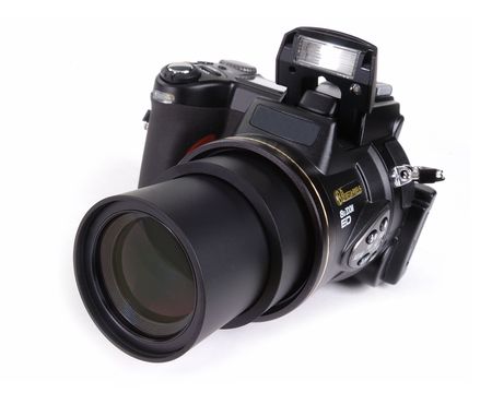 Digital SLR camera with attached zoom lens isolated on white