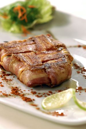 of fried meat with vegetables and saladeの写真素材