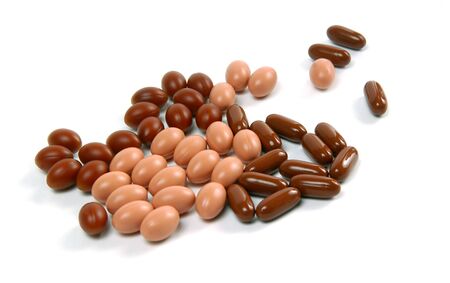 Tablets and pills isolated on the white background