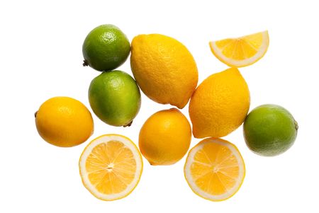  fresh yellow lemons and limes on a white backgroundの写真素材
