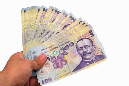 Stack of Romanian Lei held in the hand