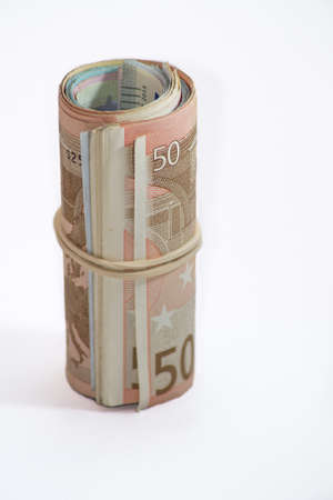Rolled up euros using rubber bandの写真素材