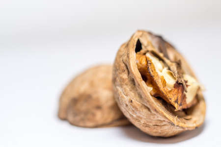 Close up nutmeat and nutshell with shallow depth of field.の写真素材