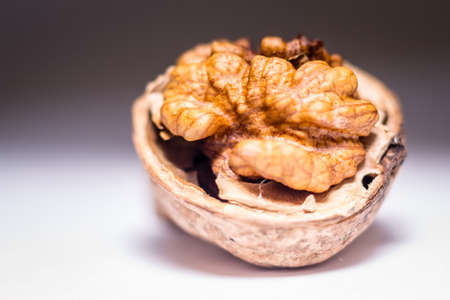 Close up nutmeat and nutshell with shallow depth of field.の写真素材