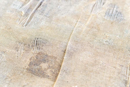 Old torn sacking grunge texture and cardboard as backgroundの写真素材