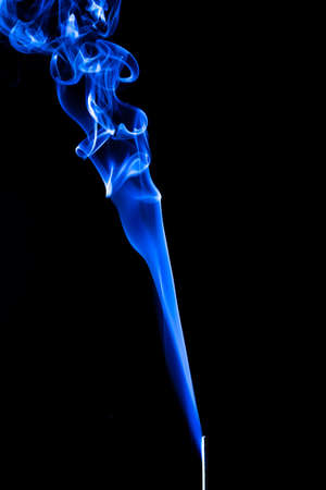 Rising smoke with different curly shapesの写真素材
