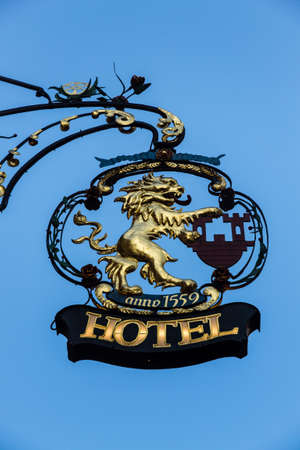 Gold crest of a hotel figuring a lion in Rothenburg ob der Tauberの写真素材