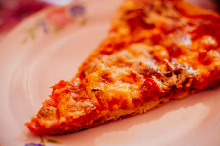 Close-up of home made delicious pizza with cheese, salami and corn