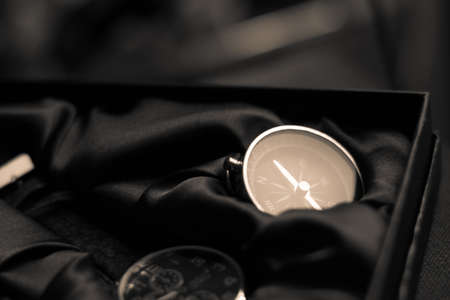 Closeup shot of a shiny metalic compass pointing always to magnetic Northの写真素材