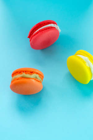 Close-up shot of colored macaroons in different positionの写真素材