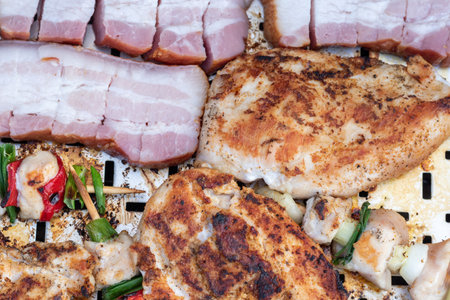 Chicken breast and pork meat pulled in wooden skewer with fresh colorful and tasty vegetables