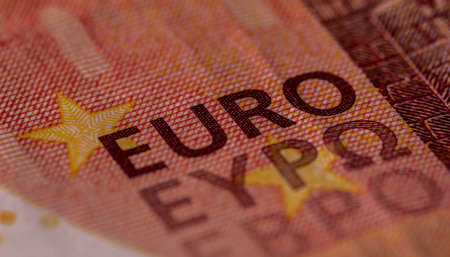 Close-up shot of Euro sign and text present on a banknoteの写真素材