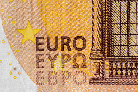 Close-up shot of Euro sign and text present on a banknoteの写真素材