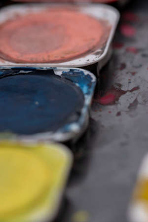 Close-up macro shot of beautiful vibrant watercolour pallete with plenty of texture and detailsの写真素材