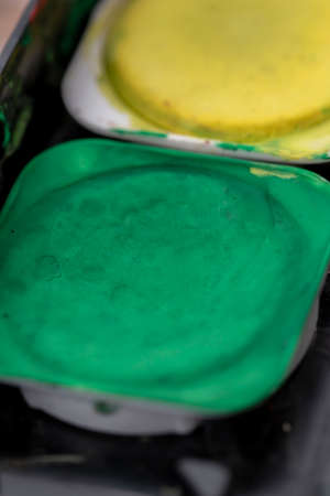 Close-up macro shot of beautiful vibrant watercolour pallete with plenty of texture and detailsの写真素材