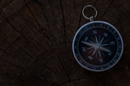 Close up shot of a silver metal compass always pointing it's needle towards Northの写真素材