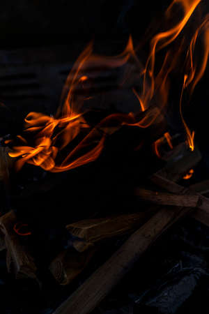 Close up shot of burning wood and charcoal used for barbeque