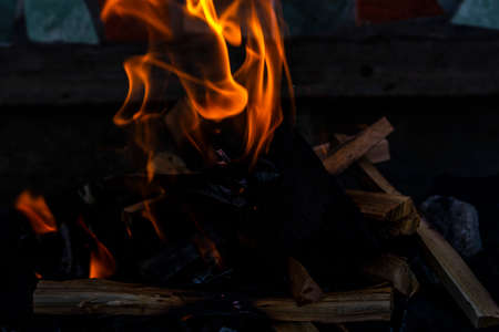Close up shot of burning wood and charcoal used for barbeque
