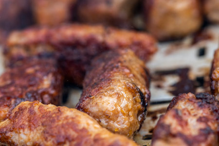 Traditional Romanian food called "mici" which consist of pork meat rollsの写真素材