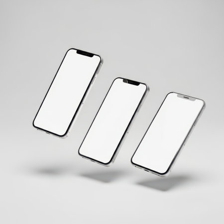This image features three sleek smartphones arranged in a triangular formation on a transparent background. The smartphones have a modern design with large, blank screens and minimal bezels. The image is clean and minimalistic, highlighting the phones against a white backdrop.の素材