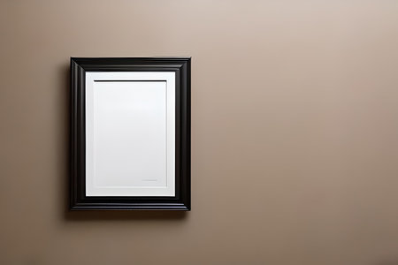 Black picture frame hanging on brown wall with copy space for your textの素材