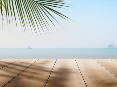 Wooden floor over blurred beach and sea background, product display montageの素材