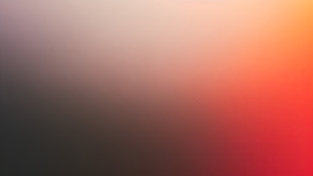 abstract background - blurred water drops on window glass with orange and red colorsの素材