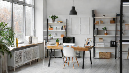 Modern office interior with wooden furniture, computer and bookshelves.の素材